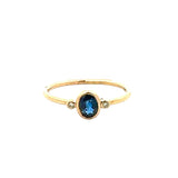 Oval Blue Sapphire and Diamond Bezel Ring