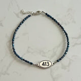 Teal Rice Shaped Freshwater Pearl Bracelet with 413 Oval Road Sign Charm