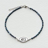 Teal Rice Shaped Freshwater Pearl Bracelet with 413 Oval Road Sign Charm